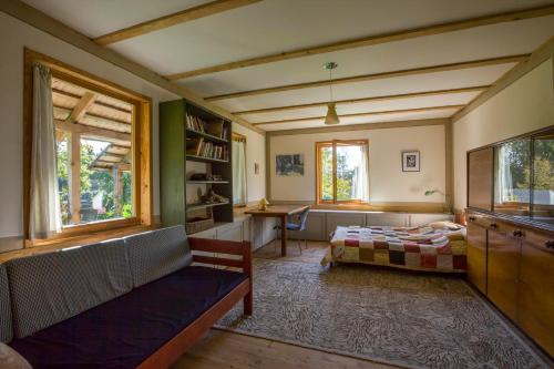 Postel nebo postele na pokoji v ubytování Dubingiai summerhouse