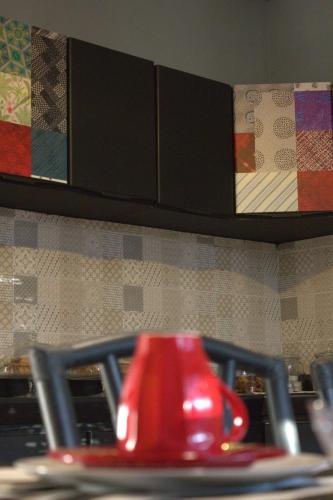 a red object on a plate in a kitchen at FiumicinoA57 in Fiumicino