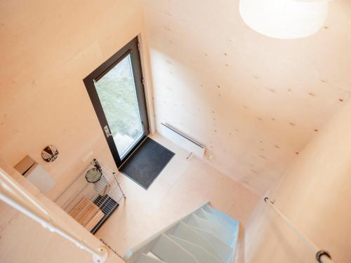 an overhead view of a tiny house with a window at Containerhus 18b in Harboør