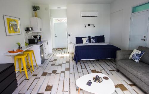 a small living room with a bed and a table at The Beach Pad Puntas in Rincon