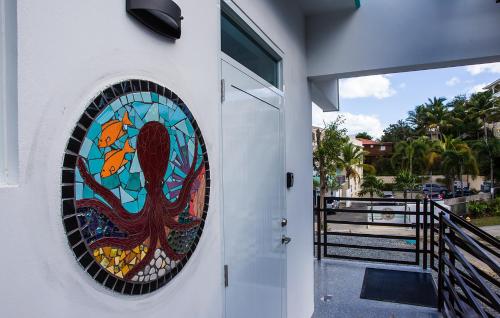 a stained glass window on the side of a building at The Beach Pad Puntas in Rincon