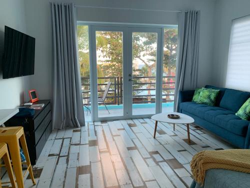 a living room with a couch and a table at The Beach Pad Puntas in Rincon