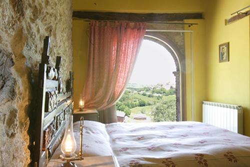 מיטה או מיטות בחדר ב-Il Giardino Degli Ulivi