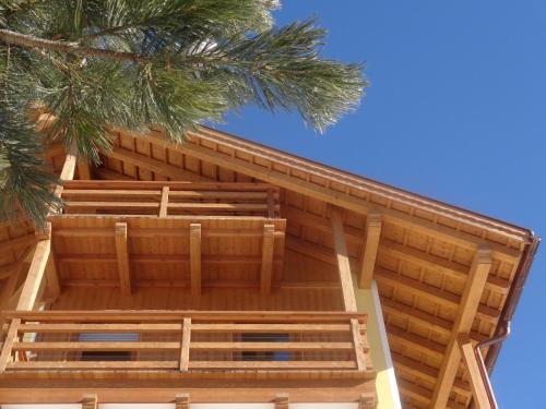 a roof of a building with a palm tree at Chalet Residence Alpinflair in Ortisei