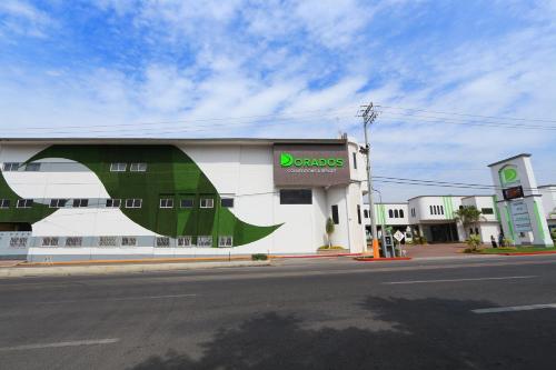 a building with a dinosaur painted on the side of it at Dorados Conventions & Resort in Oaxtepec