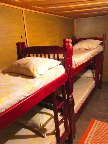 two bunk beds are in a room with at Hospedaria Nossa Senhora da Glória in Petrópolis