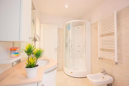 a bathroom with a shower and a sink and a toilet at Ca' Lunetta - 5' from St. Mark Square in Venice
