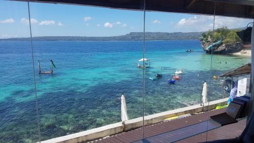 a view of a beach with people in the water at Jelly Sea Resort in Siquijor