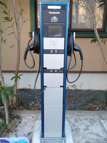 a gas pump with headphones on top of it at Mitsui Bekkan in Yonago