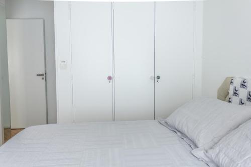 Una cama o camas en una habitación de Optimus BA | Arenales