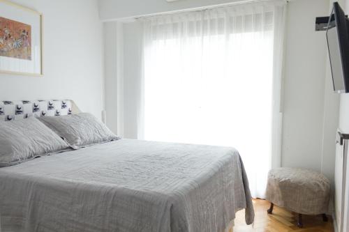 Una cama o camas en una habitación de Optimus BA | Arenales