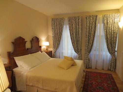 
Ein Bett oder Betten in einem Zimmer der Unterkunft Casa Panvinio
