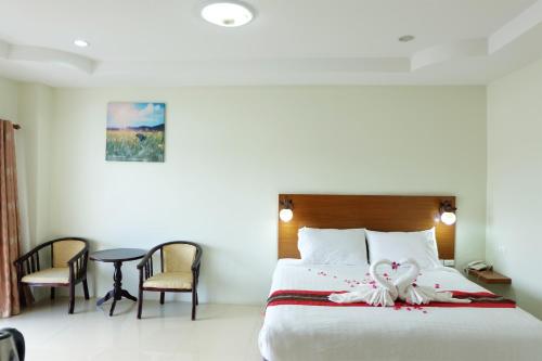 Krevet ili kreveti u jedinici u okviru objekta Chaophayathara Riverside Hotel