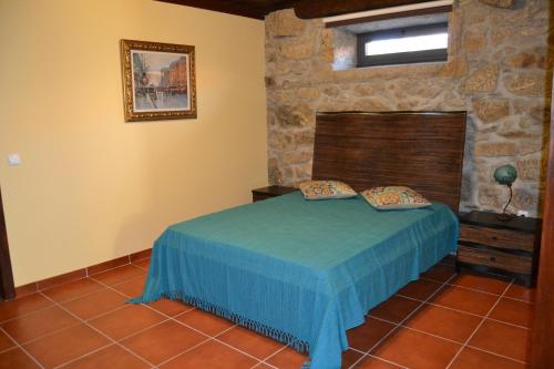 A bed or beds in a room at Quinta do Real - Casa de Campo