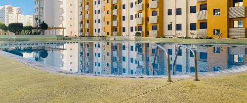 a swimming pool in the middle of a building at Ático el Balcón de Gandía in Gandía