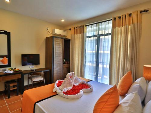 a living room with a couch and a table at ROYAL KASHYAPA - Habarana in Habarana