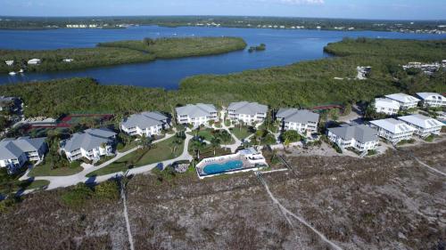 an aerial view of a home on the shore of a lake at Palm Island Villa 2 Bedroom Deluxe Villa in Cape Haze