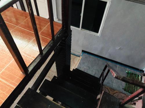 an overhead view of a staircase in a house at Bang sit Guest House in Phi Phi Don