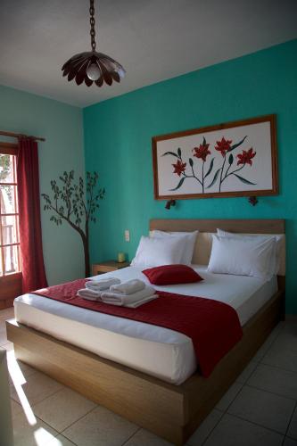 a bedroom with a large bed in a room at Nemesis in Neo Klima