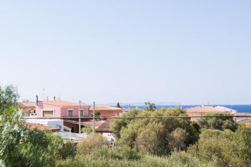 a view of a town with houses and trees at MOSAIC in Sa Ràpita