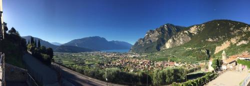 a view of a town in a valley with mountains at Agritur Acetaia Gourmet&Relax in Tenno