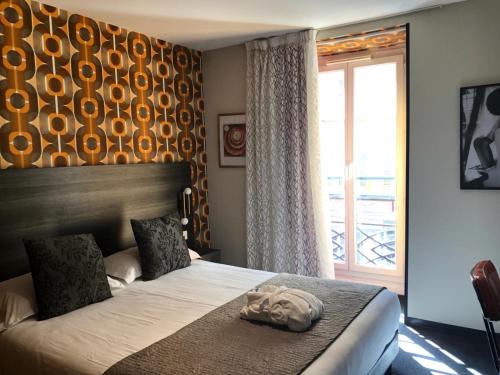 Cama o camas de una habitación en Hôtel Le G (ex Le Genève)