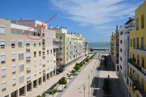 a building with a red circle in the middle of a street at Expo Marina Lis in Lisbon