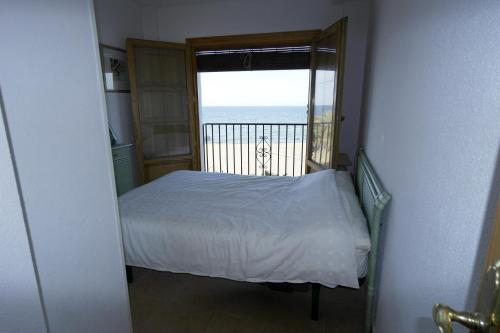 a bedroom with a bed and a view of the ocean at AR3B, Arsenal Barry, en primera línea in Villajoyosa