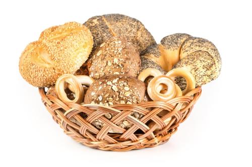 a basket filled with different types of bread at Danhostel Sønderborg City in Sønderborg