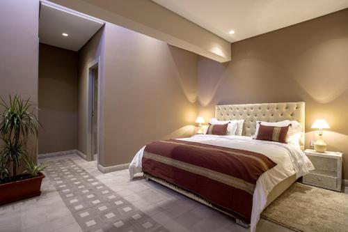 a bedroom with a large bed in a room at BnB MEDINA in Marrakech