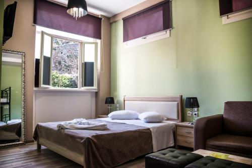 Postel nebo postele na pokoji v ubytování Asimoni Pension