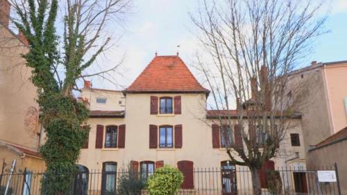 a large white house with a red roof at CHAPELLE ST NICOLAS in Roanne