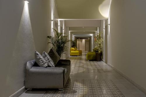 a hallway with a couch and chairs in a building at BnB MEDINA in Marrakech