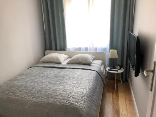 Postel nebo postele na pokoji v ubytování CR Komfortowy Apartament blisko Centrum