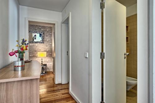 a bathroom with a sink and a toilet in a room at MyPlaceLisbon - Bairro Alto Apartment in Lisbon