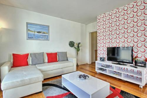 a living room with a couch and a tv at MyPlaceLisbon - Bairro Alto Apartment in Lisbon