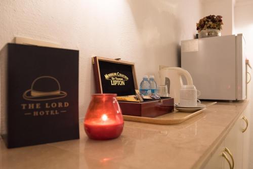 a counter top with a box and a candle on it at Hotel The Lord in Ghent