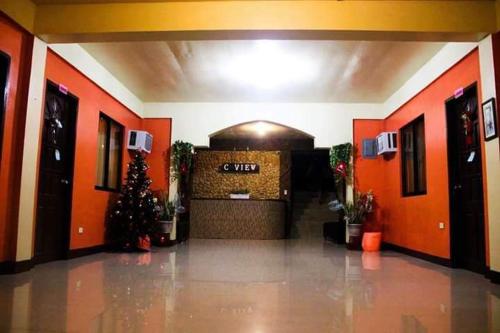 a lobby with a christmas tree in a building at C View Resort in Sipalay