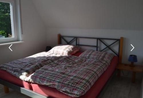 Ein Bett oder Betten in einem Zimmer der Unterkunft Frische Brise