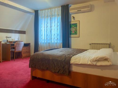 En eller flere senger på et rom på Villa Vodno