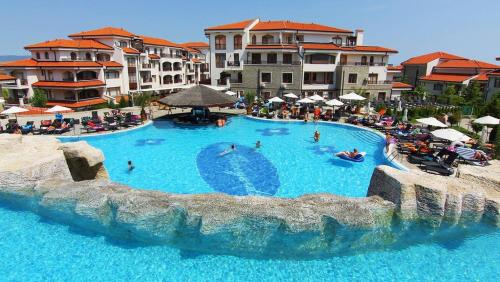a large swimming pool with people in a resort at 4* Luxury spa resort - Aheloy, Nessebar, Sunny Beach in Pomorie
