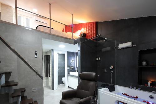 a living room with a sink and a mirror at RedRose Piran in Piran