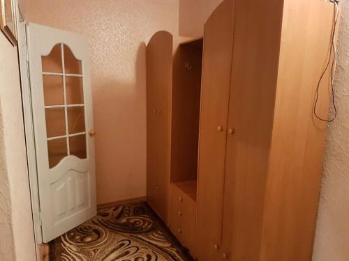 a room with a door and a cabinet in a room at Apartment on Y. Mudroho 44 in Bila Tserkva