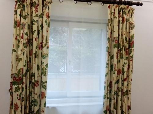 a window in a room with a curtain at At Home Sintra in Sintra