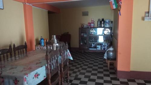 a dining room with a table and some chairs at Vamoose Norlha in Takdāh