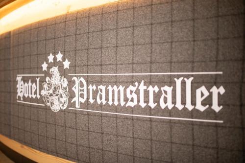 a sign on the side of a table with the word amincinnati at Hotel Pramstraller in Mayrhofen