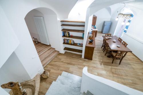 a staircase leading to a living room and a dining room at Pippi's Home Finale con box auto in Orco Feglino