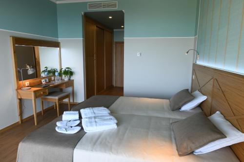 Posteľ alebo postele v izbe v ubytovaní Hotel Do Campo