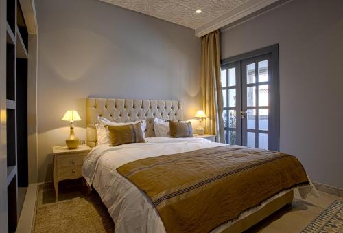 a bedroom with a large bed and a window at BnB MEDINA in Marrakech