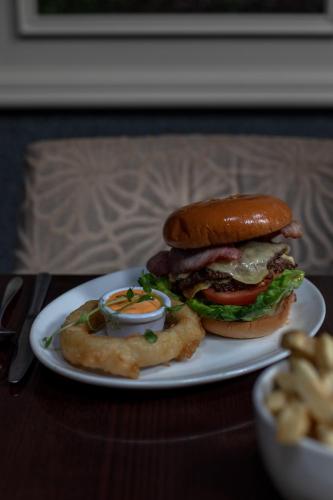 a sandwich on a plate on a table at The Horse and Hound Hotel in Ballynabola